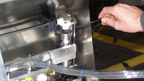 Stripping station of ice cream cones.