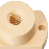 Ecrou à collerette à surface de serrage